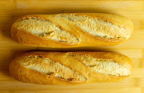 Close-up of Baguette on Wooden Chopping Board