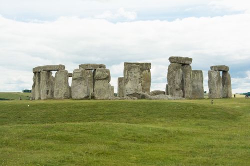 Free Captivating photograph of Stonehenge, a prehistoric monument in England, seen under a cloudy sky. Stock Photo