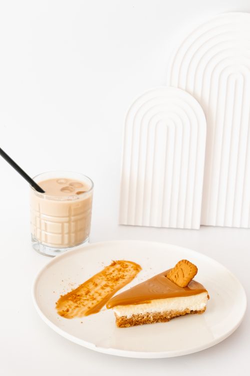 Free Delicious caramel cheesecake on a ceramic plate with iced coffee Stock Photo