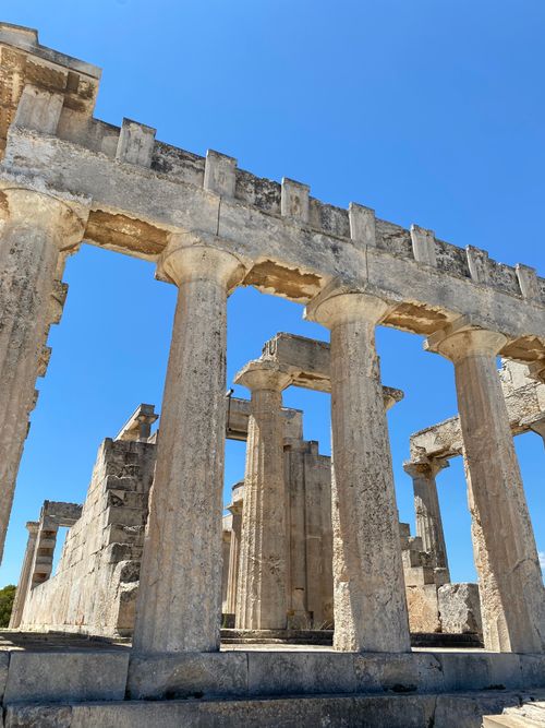 Free Explore the majestic ruins of an ancient Greek temple in Aegina, Greece under a clear blue sky. Stock Photo