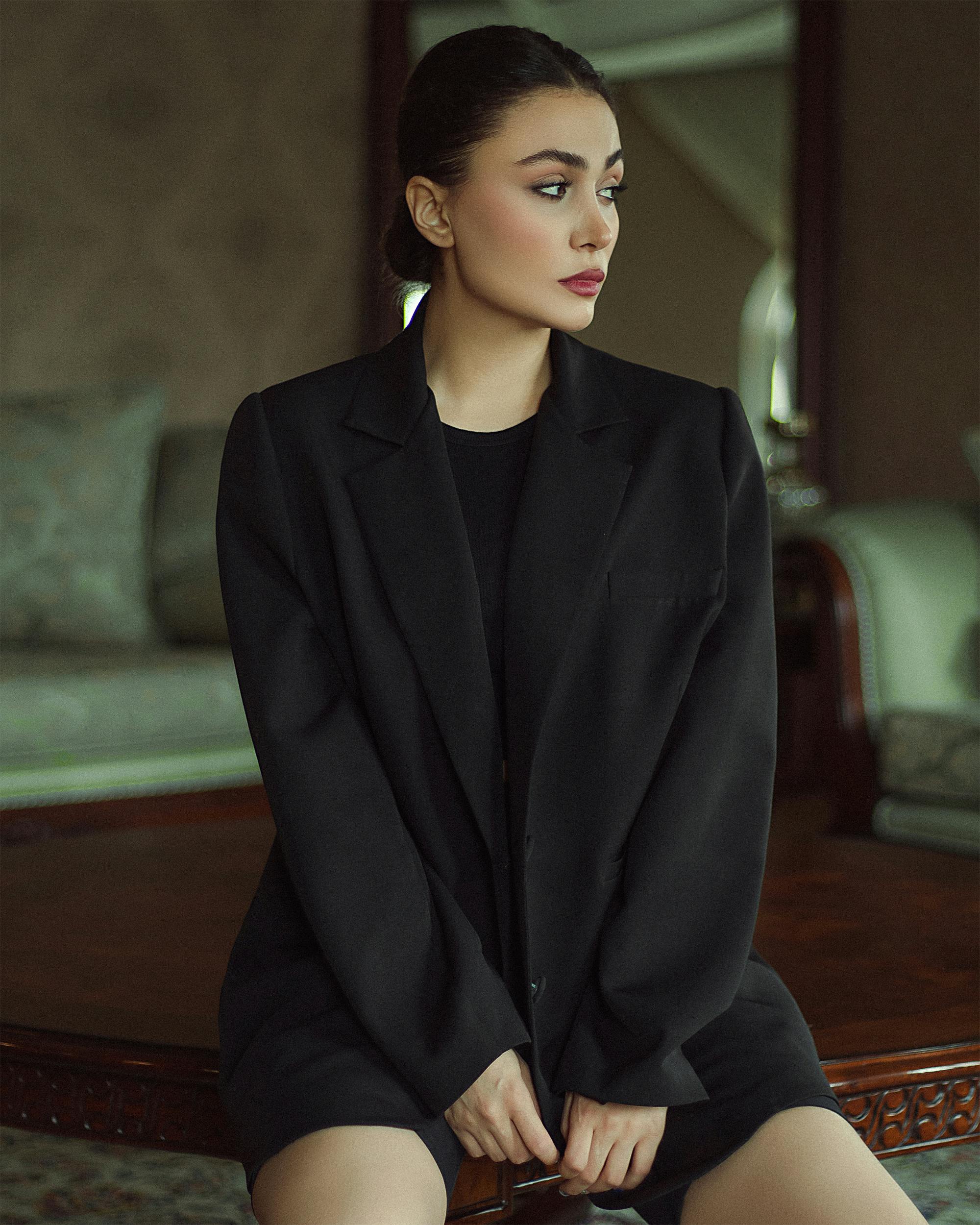 portrait of a model in black suit and shorts