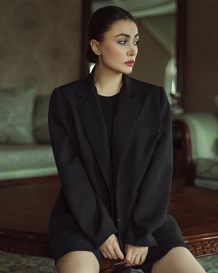 Portrait Of A Model In Black Suit And Shorts