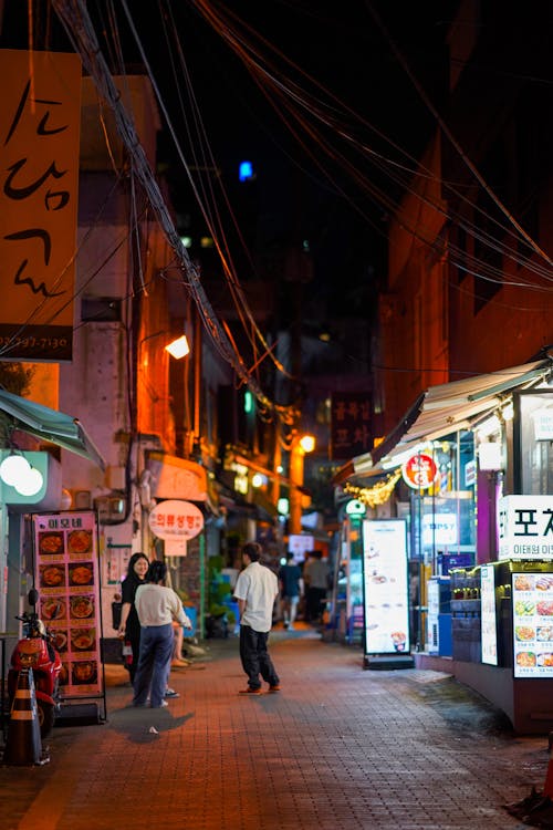 People at an Alley at Night