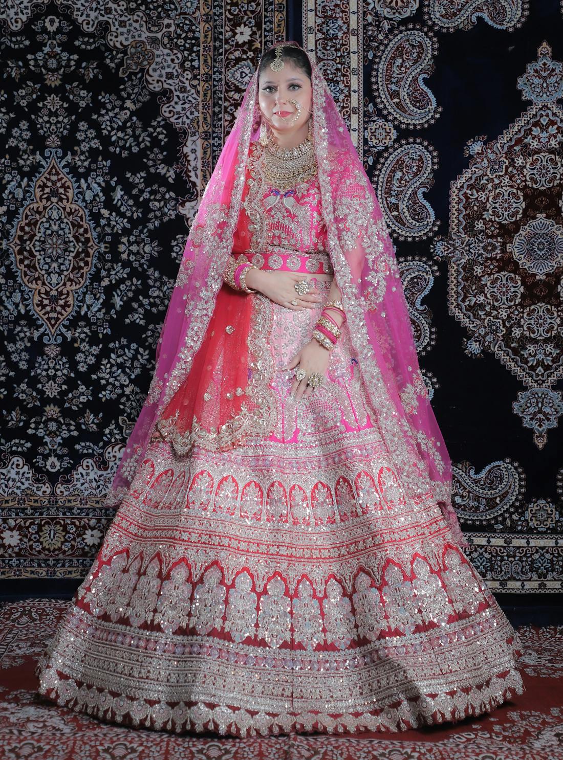 Pastel pink lehenga with ornate jewel yoke and ombré skirt