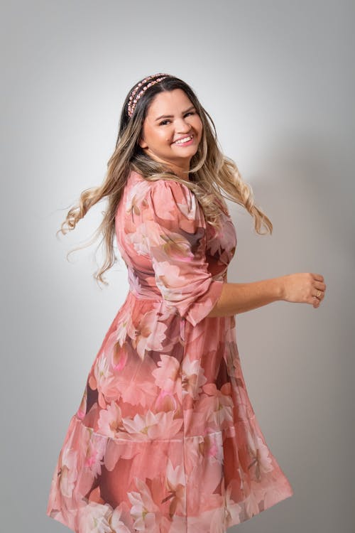 A Pretty Woman in Floral Dress Smiling