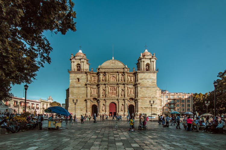 People Outside Oaxaca Cathedral In Mexico