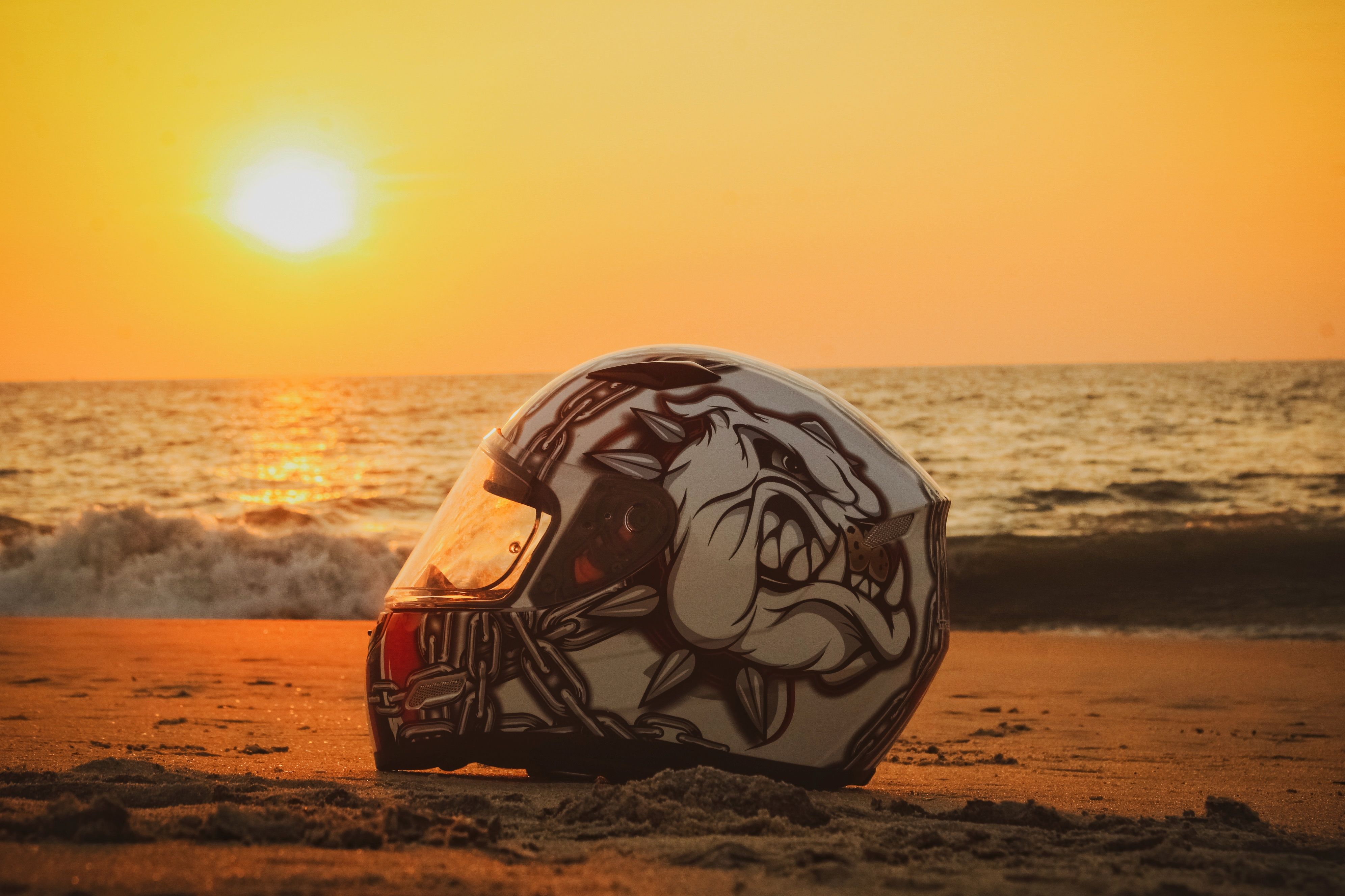 beach motorcycle helmet Close-Up Shot of a Motorcycle Helmet on the Beach · Free Stock Photo