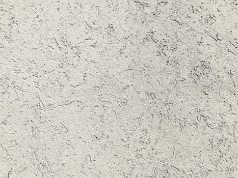Close-up of a rough textured concrete wall surface, ideal for backgrounds and design elements.
