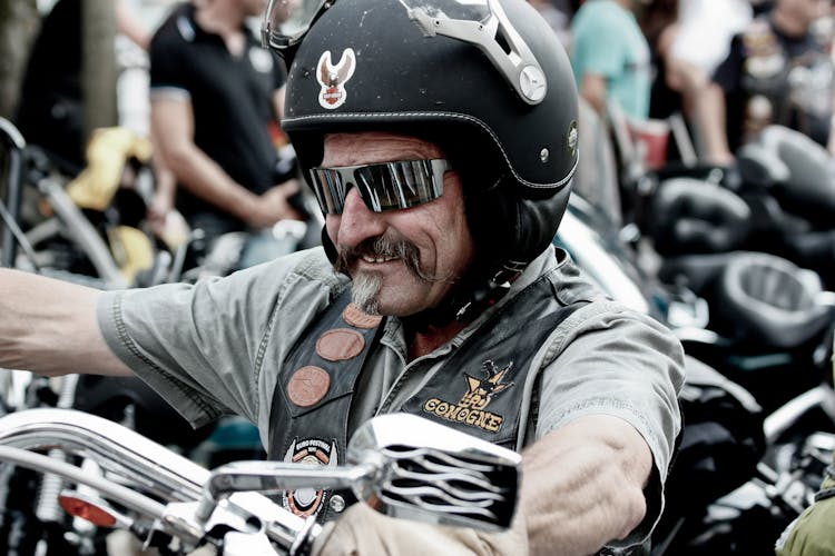 Close-Up Shot Of A Man Riding A Motorcycle 