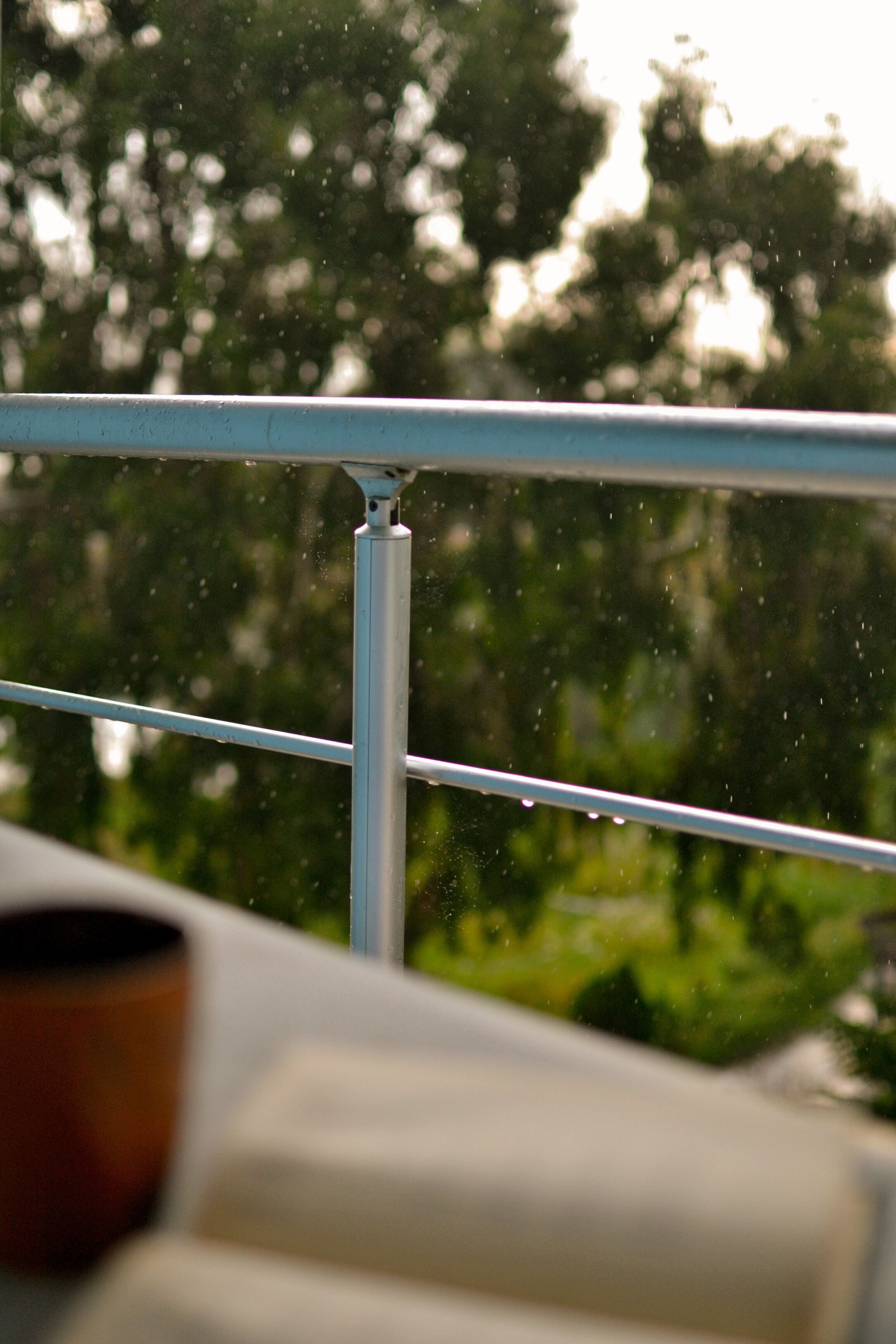 Wet Metal Railing on a Rainy Day · Free Stock Photo