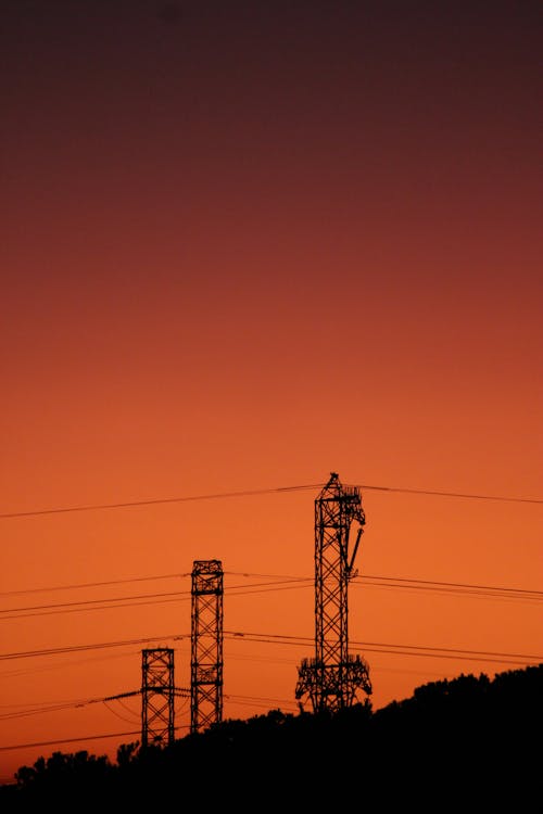 Silhouette of Electric Poles during Sunset