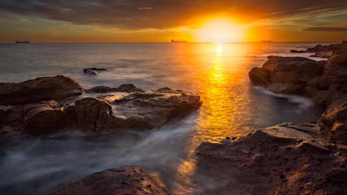 Безкоштовне стокове фото на тему «берег моря, довга експозиція, Захід сонця»