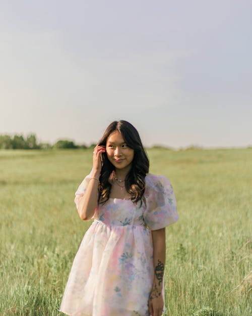 Woman Wearing Dress Standing in the Field