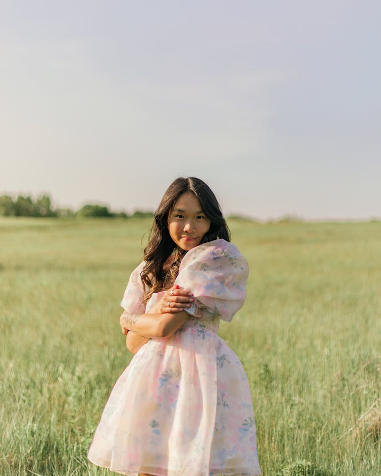 Portrait Of A Girl In Pastel Dress In Meadow