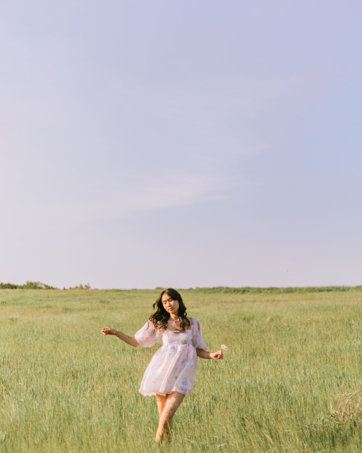 Woman in White Dress Standing on a Grassy Field · Free Stock Photo