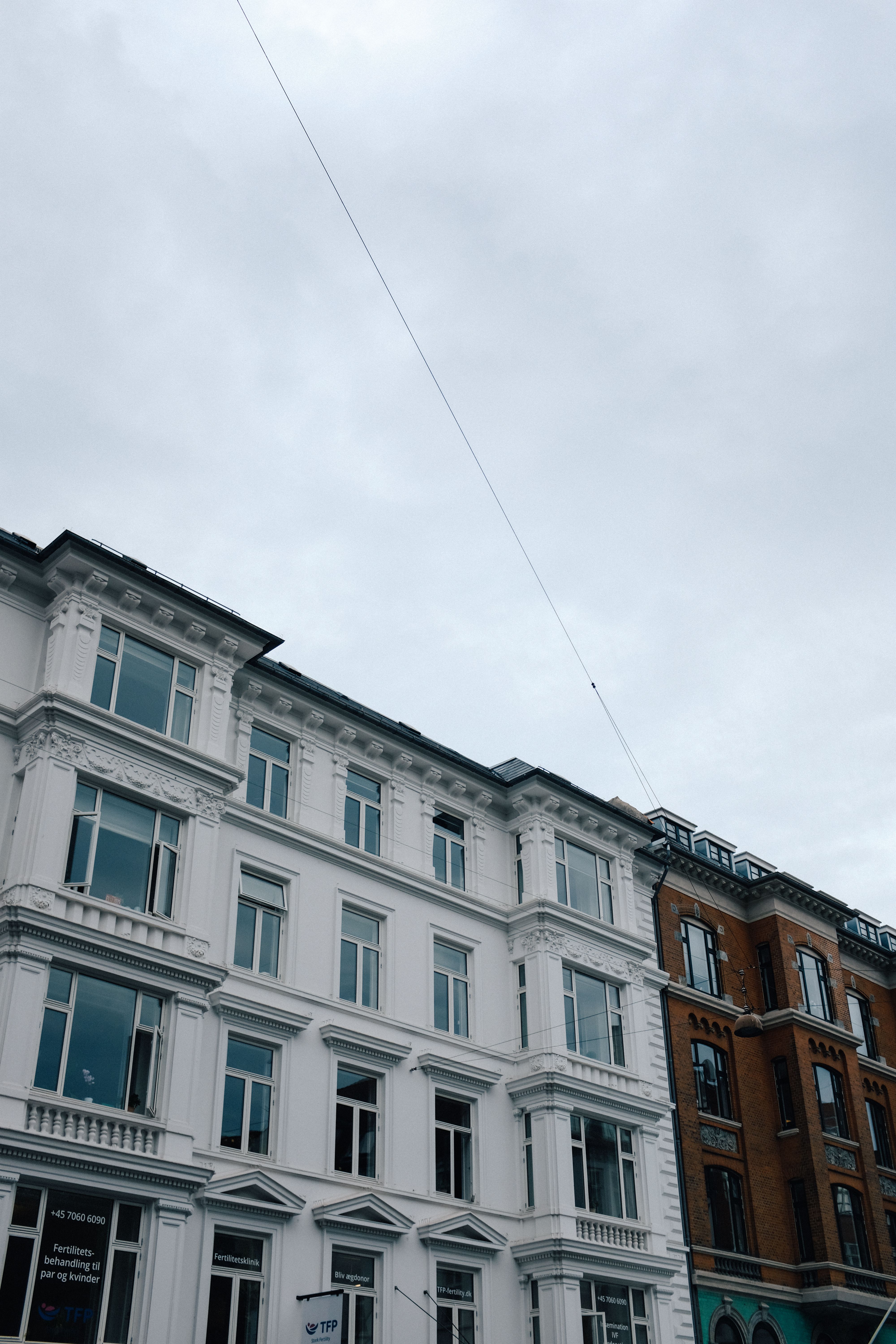 Buildings under a Cloudy Sky · Free Stock Photo