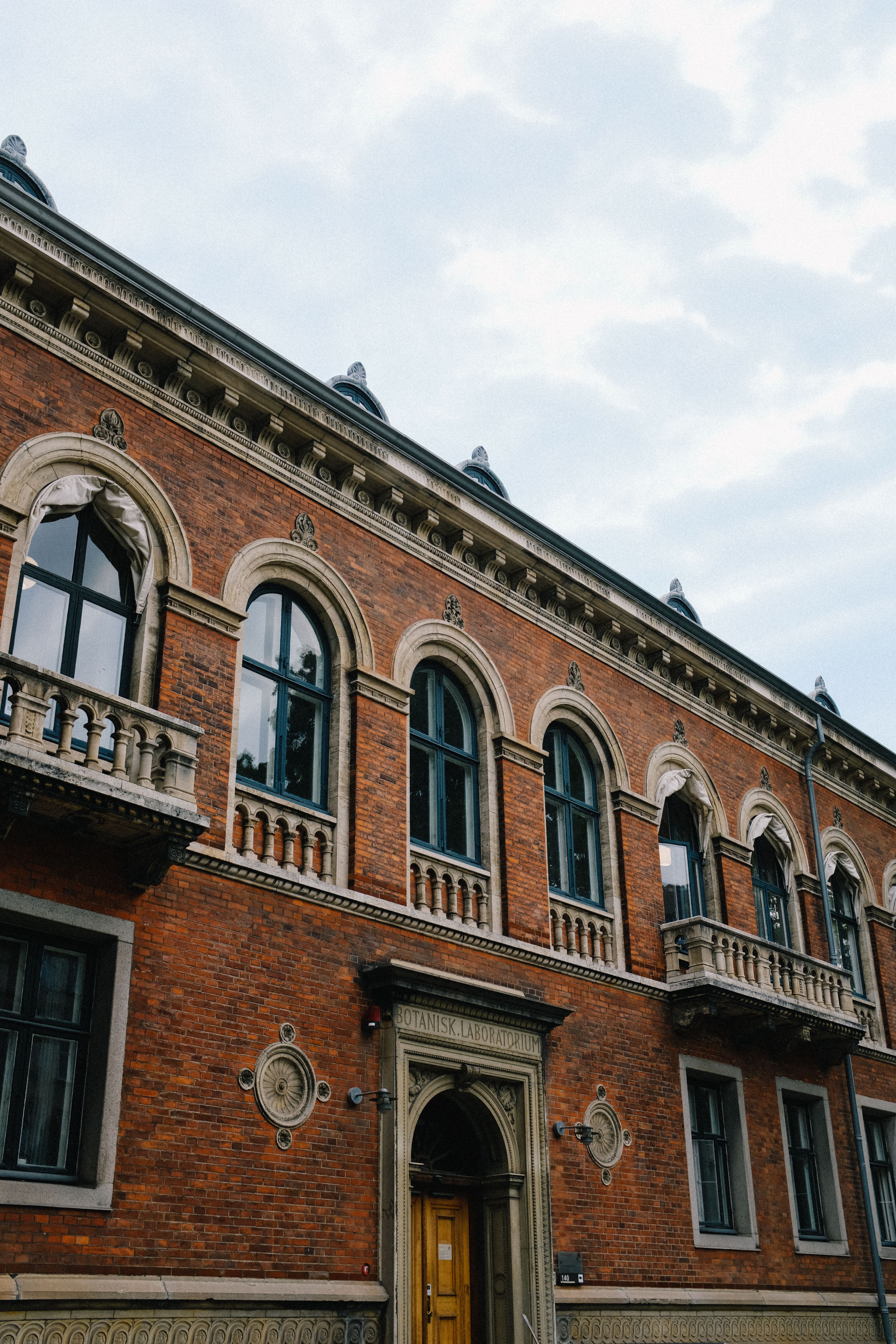 Balconies and Windows of a Brick Building · Free Stock Photo