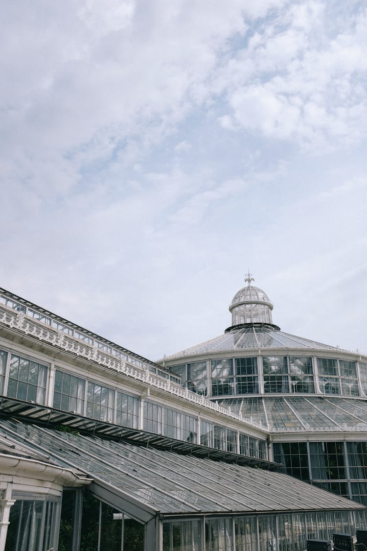 Glass Building With Dome On Blue Sky