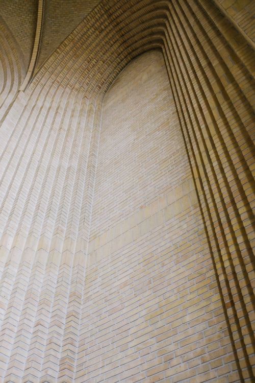 Free Elegant low angle view of a brick archway showcasing intricate patterns and minimalist design. Stock Photo