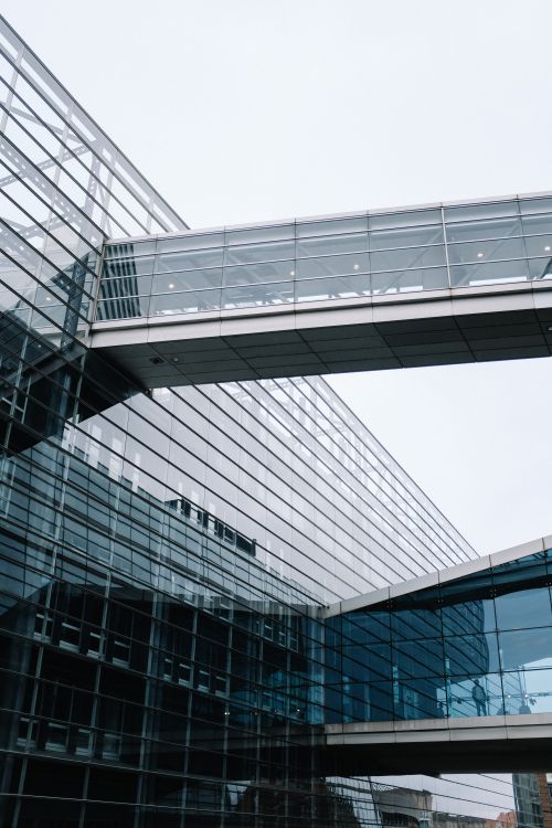 Free A striking modern architectural design featuring glass facades and sky bridges. Stock Photo