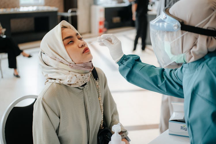 Doctor Performing Swab Test