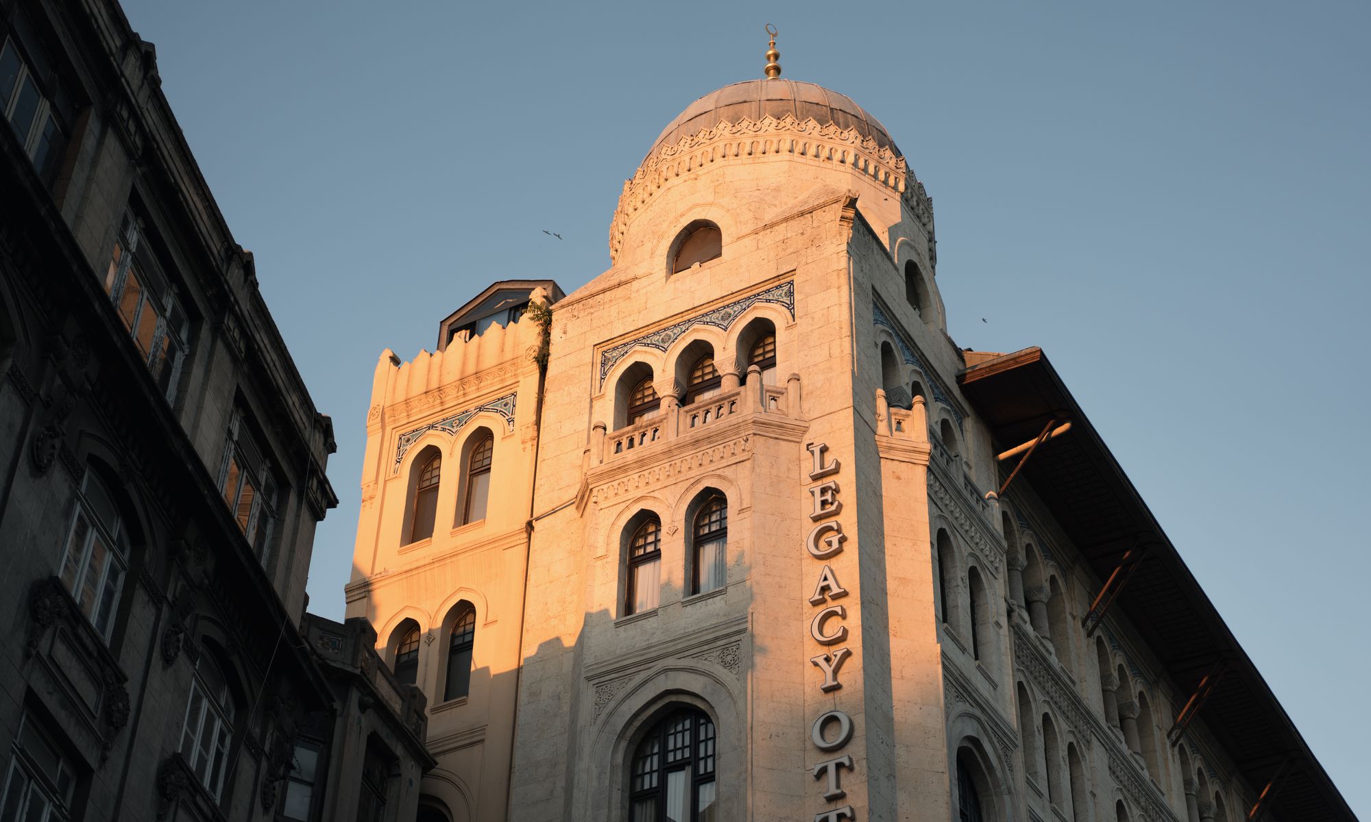 Aurelia Grand hotel exterior at golden hour