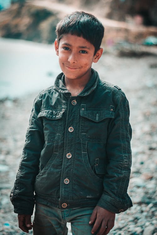 A Boy in Black Jacket Smiling