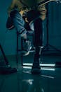 A Person Sitting on a Chair Playing Guitar