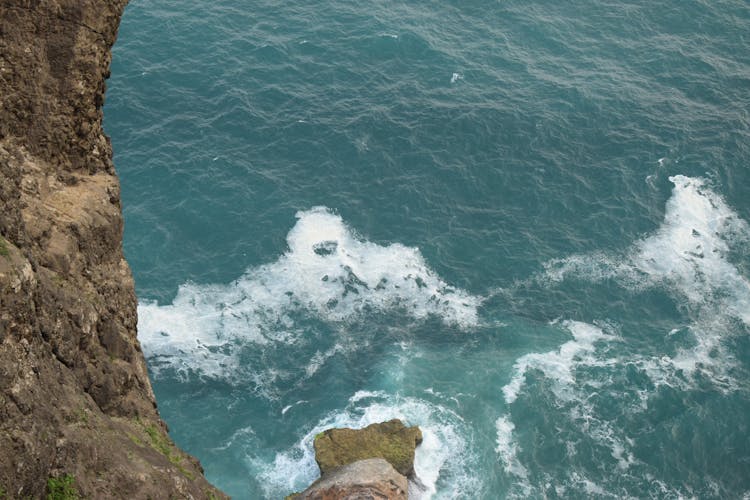 Waves Crashing The Coastal Rock Mountain