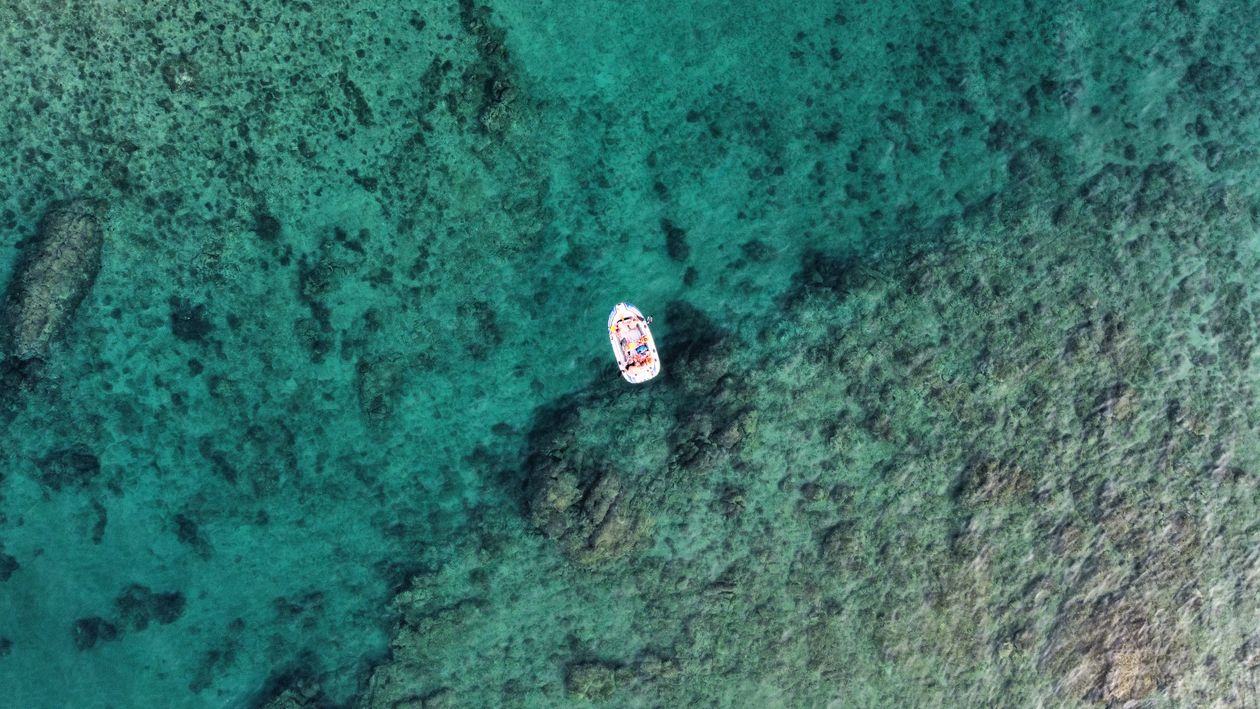 Aerial Photography of a White Boat on the Ocean · Free Stock Photo