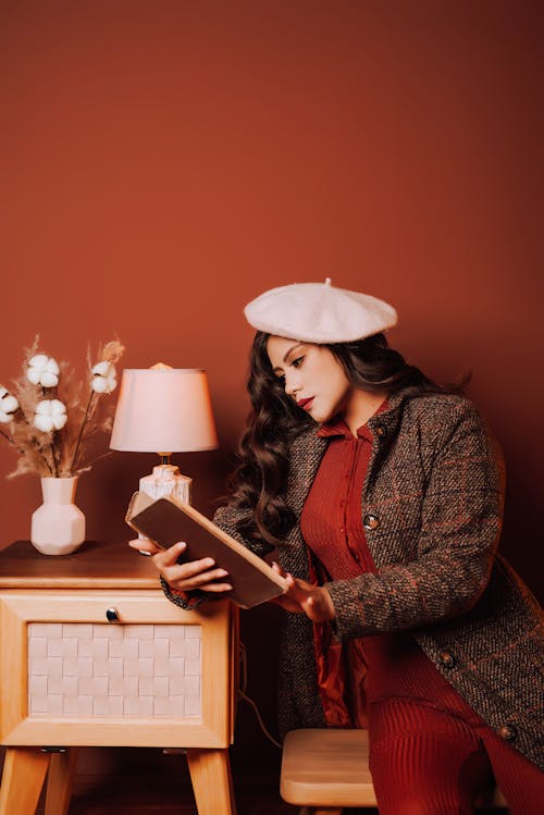 Free Woman in Retro Clothes Reading Book Stock Photo