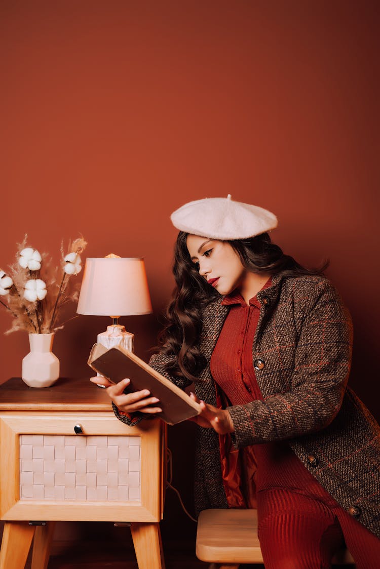 Woman In Retro Clothes Reading Book