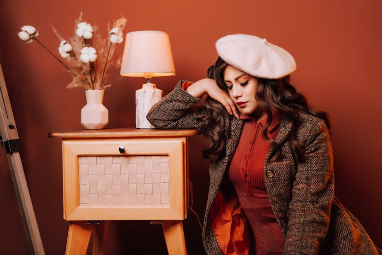 Woman In Retro Clothes On Red Wall Background