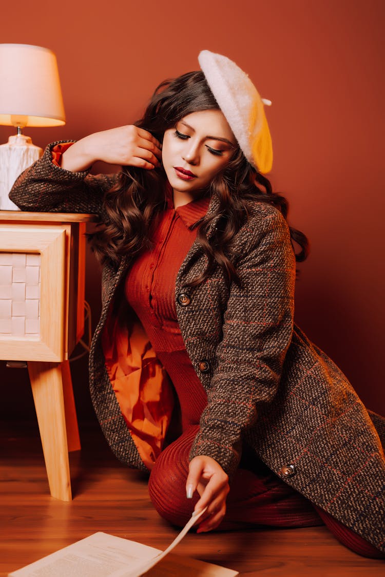 Woman In Vintage Clothes Sitting On Floor