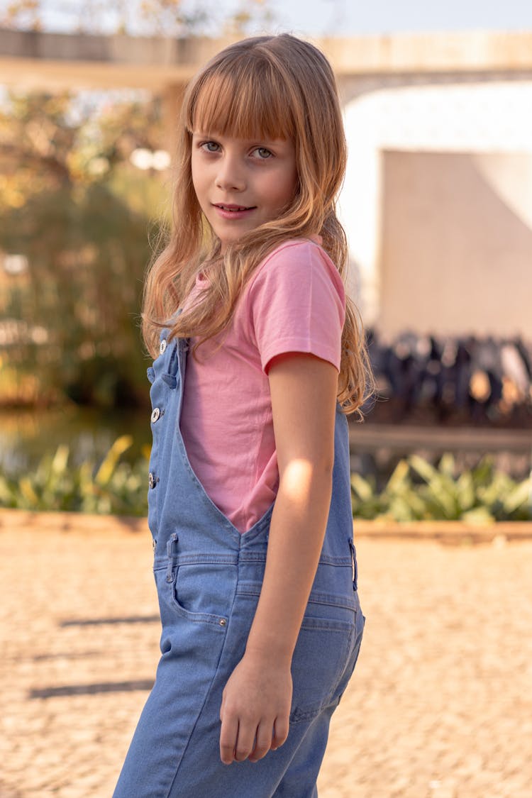 A Girl In Blue Overalls