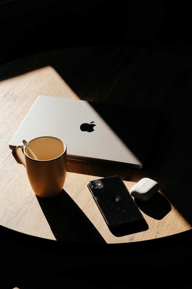 Abstract Shot Of Sunlight And Shadow On A Table With Laptop