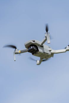 A dynamic shot of a drone soaring in the sky, showcasing modern technology and innovation.