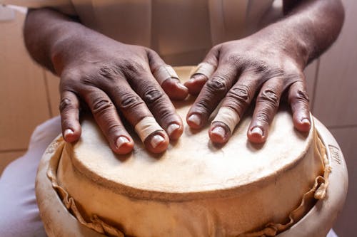 Close-up of Hands Playing the Drum 