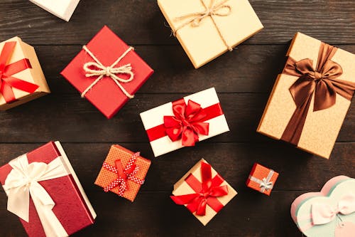 Free Wrapped Gift Boxes With Ribbons on Table Stock Photo