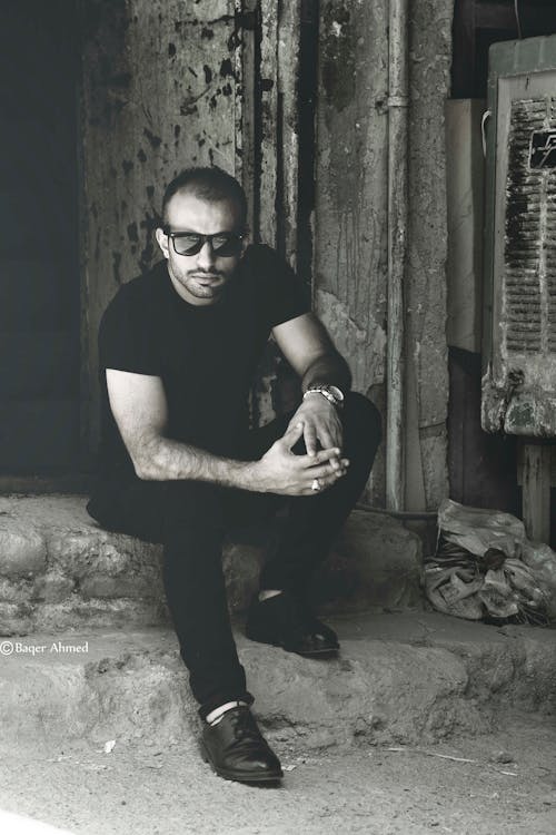 Grayscale Photo of a Man in Black Shirt Wearing Sunglasses