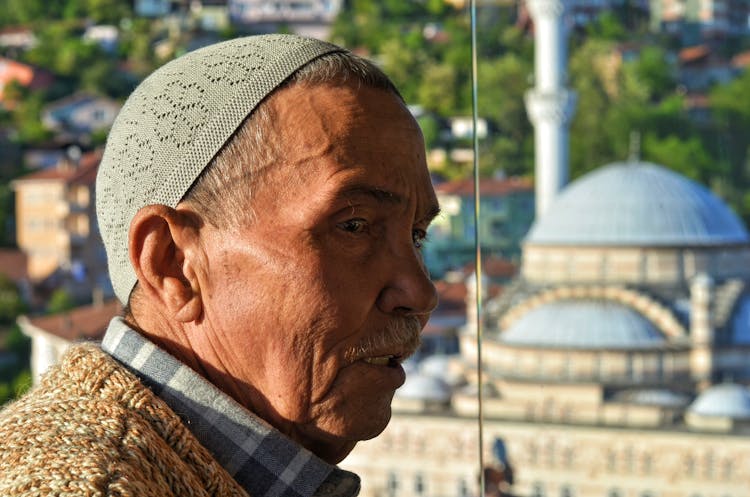 Elderly Man Wearing A Kufi Hat