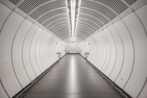 Free Modern subway tunnel with futuristic design in Vienna, Austria, featuring sleek lines and bright lighting. Stock Photo