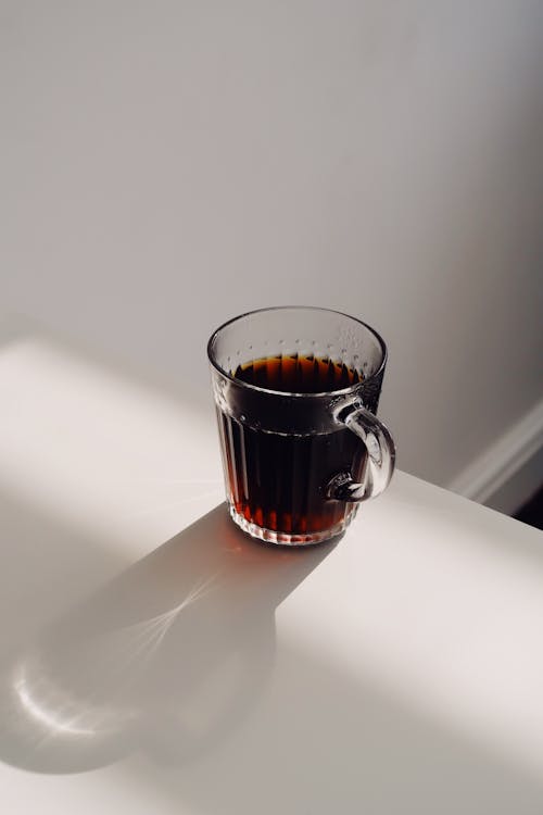 Free Clear Glass Mug on White Table Stock Photo
