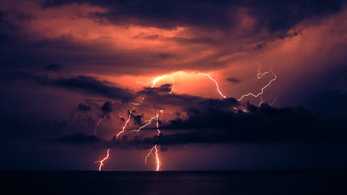 Lightning Strikes over the Ocean at Night