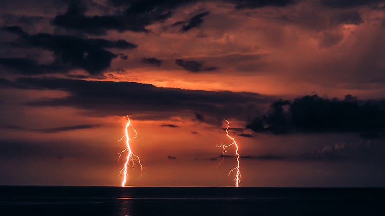 Lightning Strikes In The Ocean At Night