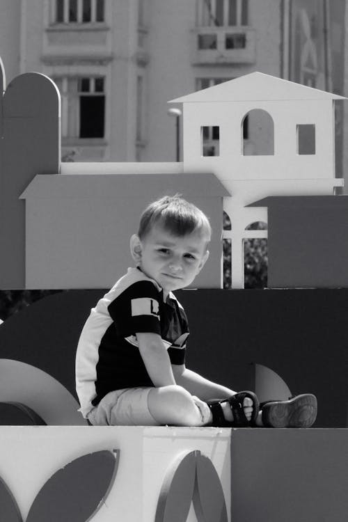 Grayscale Photo of a Kid