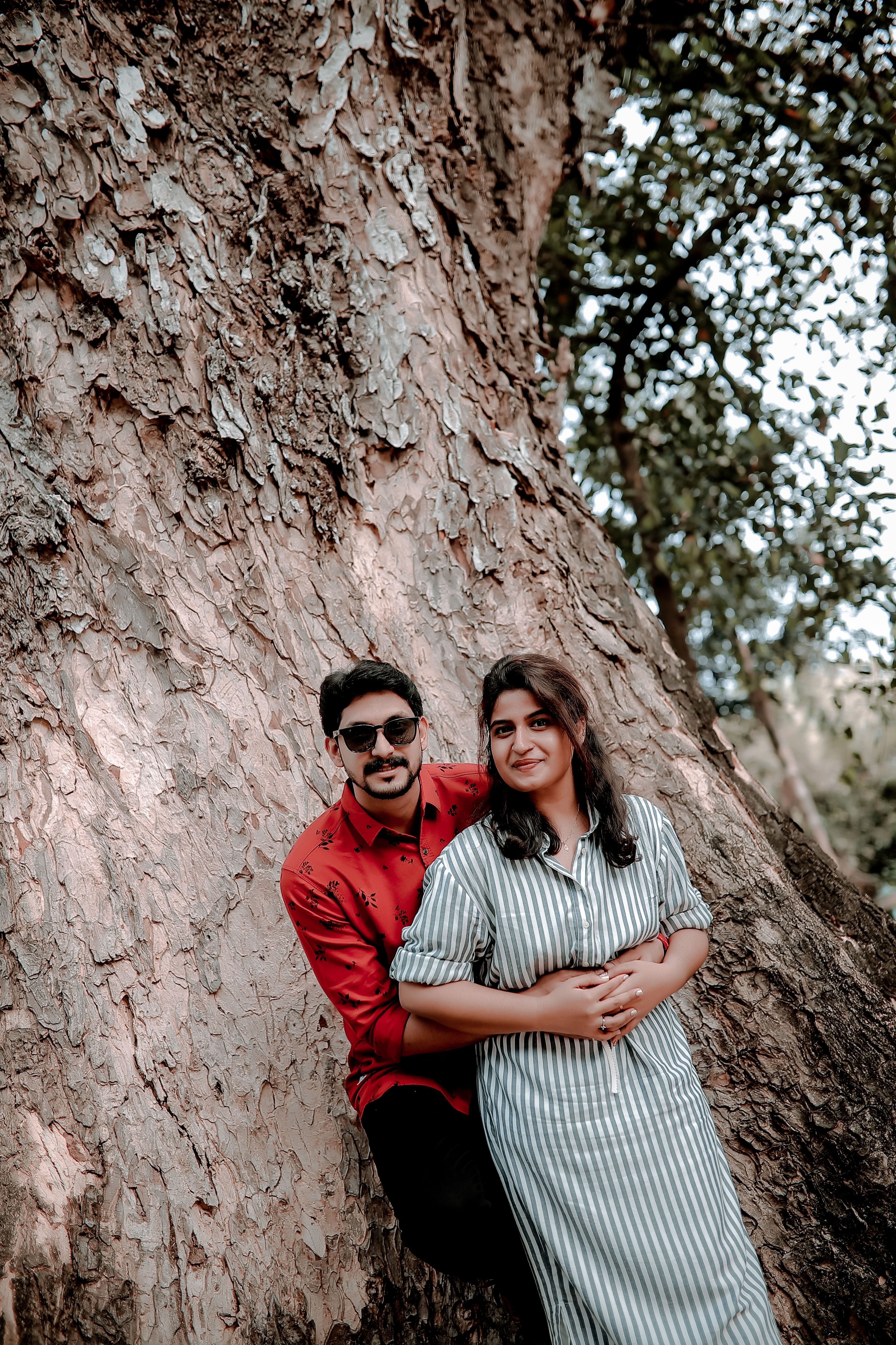 A Couple Posing under a Tree · Free Stock Photo