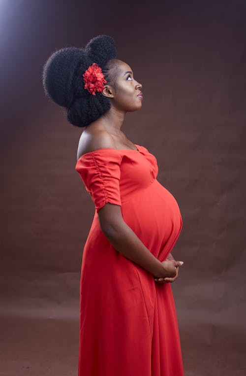 A Pregnant Woman in Red Dress