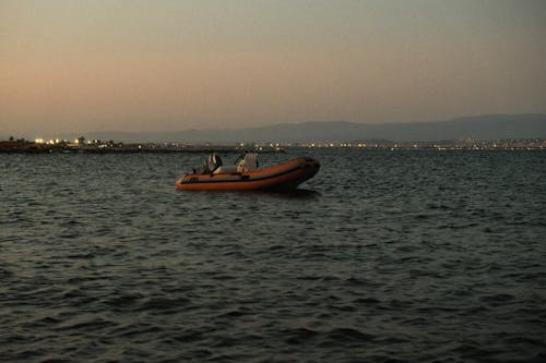 An Orange Rubber Boat on the Sea