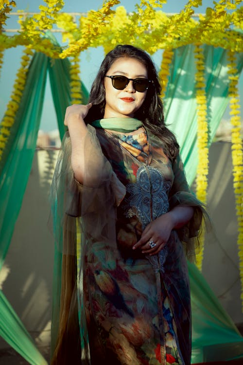 A Woman in Printed Dress Wearing Sunglasses